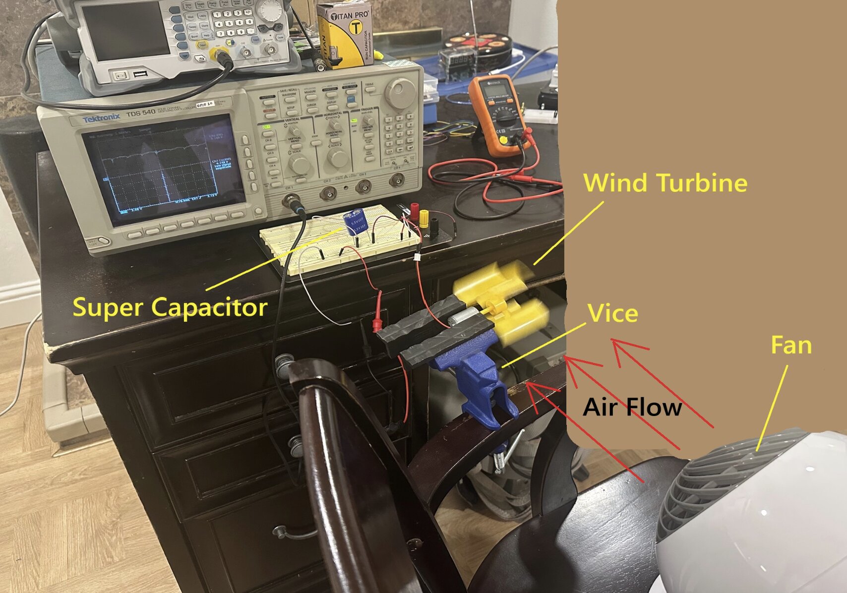 Bench setup with a turbine, supercapacitor and oscilloscope